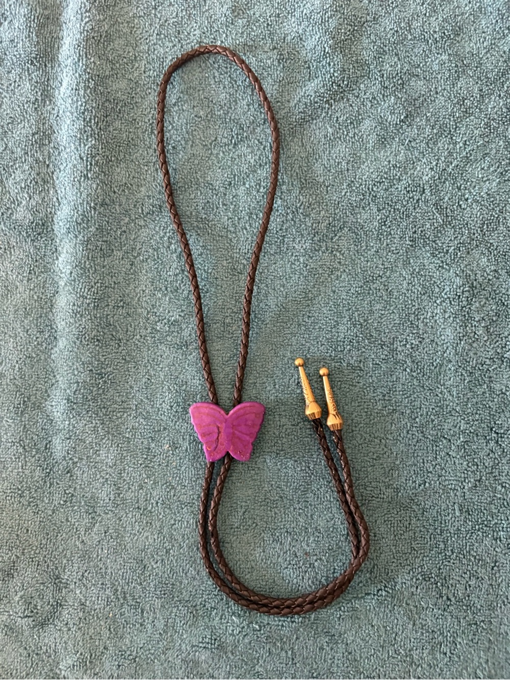 Purple Butterfly Bolo Tie with Brown Braided Cord and Gold Tips